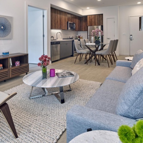 Spacious living areas to recline and recharge a living room with a couch and a table