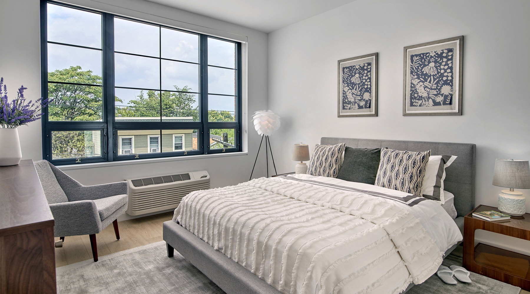 a bedroom with a bed and a chair